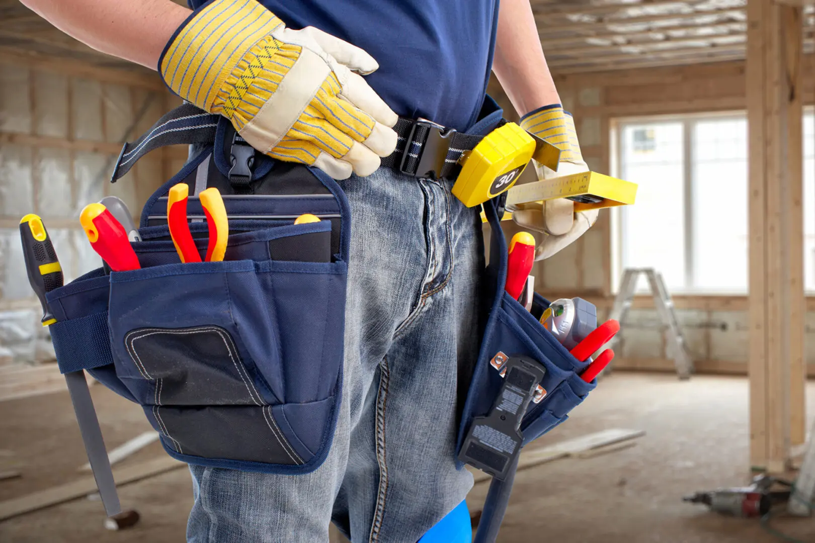 A construction worker with a tool belt